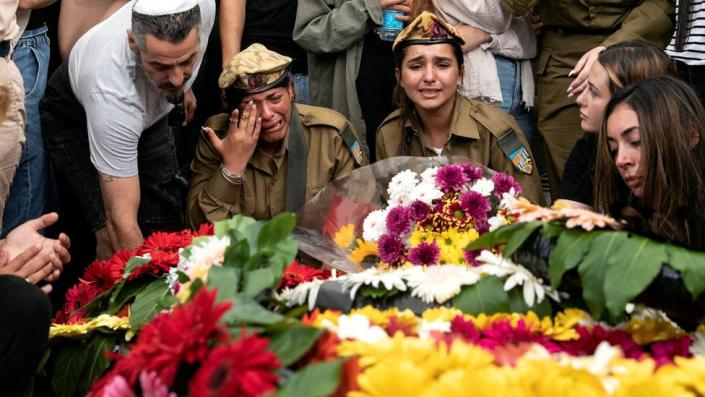 Friends and family mourn Sgt Lia Ben-Nun, an Israeli soldier who was killed by an Egyptian policeman near the Israel-Egypt border, during his funeral in Rishon Lezion, Israel (June 4, 2023)