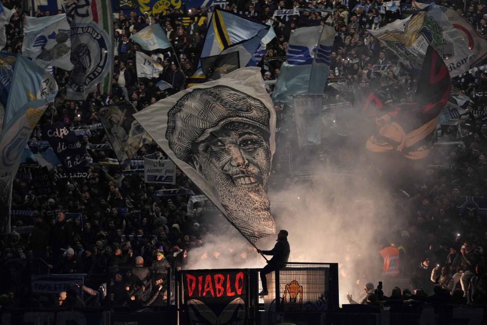 Lazio supporters waves flags during a Serie A soccer match between Lazio and Inter Milan, at Rome's Olympic Stadium, Sunday, Dec. 17, 2023. (AP Photo/Andrew Medichini)