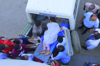 In this image made from video, an injured victim of an alleged airstrike on a village arrives in an ambulance at the Ayder Referral Hospital in Mekele, in the Tigray region of northern Ethiopia, Wednesday, June 23, 2021. An airstrike hit a busy market in Ethiopia's northern Tigray village of Togoga on Tuesday and killed at least 51 people, according to health workers who said soldiers blocked medical teams from traveling to the scene. (AP Photo)