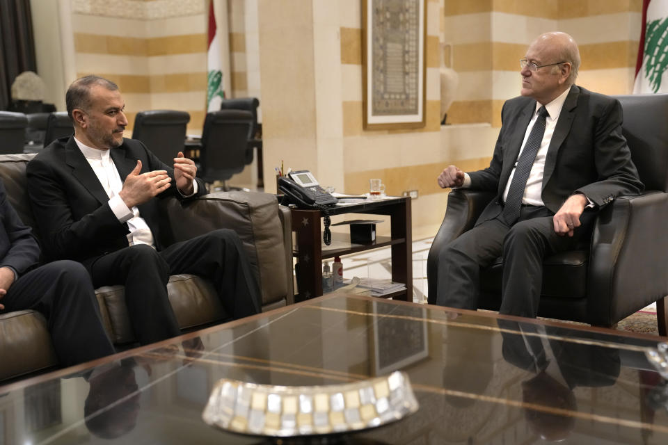 Lebanese caretaker Prime Minister Najib Mikati, right, meets with Iranian Foreign Minister Hossein Amirabollahian, in Beirut, Lebanon, Thursday, April 27, 2023. Amirabdollahian said Thursday Tehran encourages all Lebanese officials and parties reach an agreement to elect a new president in the crisis-hit country that has been without a head of state October. He added that Tehran backs any such agreement reached by rival Lebanese groups. (AP Photo/Hussein Malla)