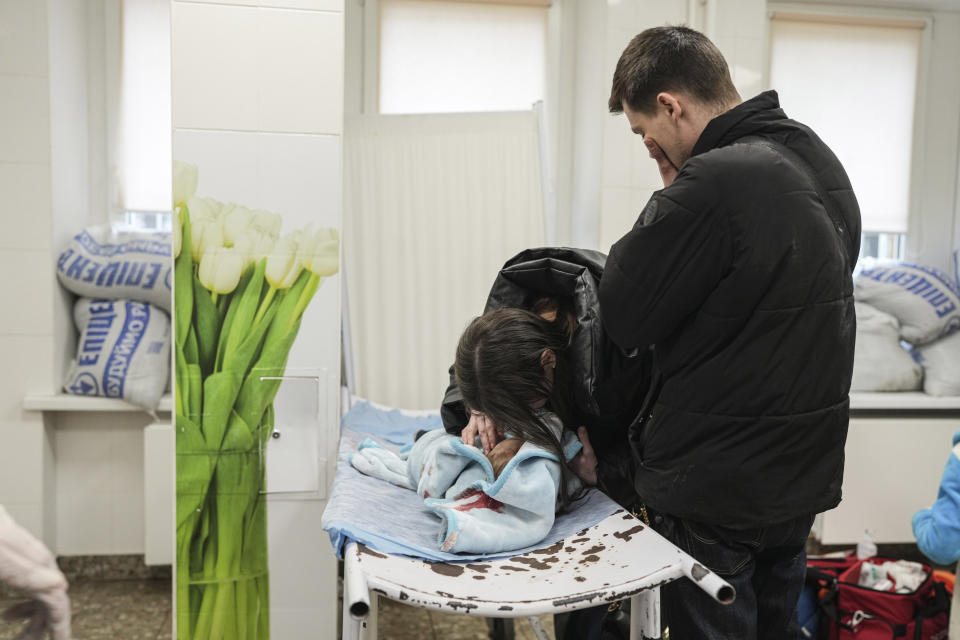Marina Yatsko and her boyfriend, Fedor, mourn over her 18-month-old son Kirill.