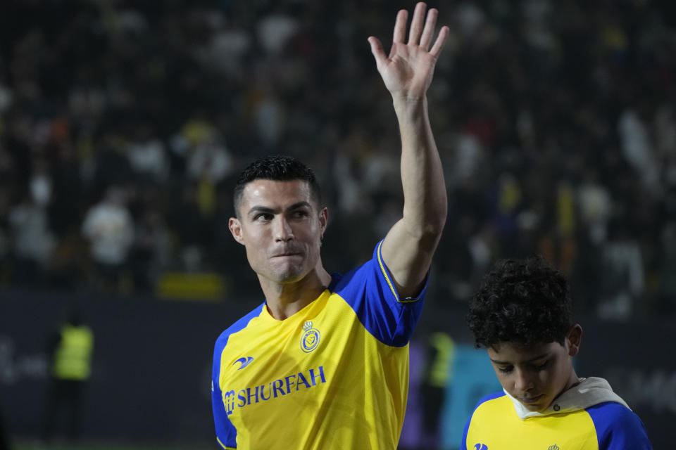 Cristiano Ronaldo reacts during his official unveiling as a new member of Al Nassr soccer club in in Riyadh, Saudi Arabia, Tuesday, Jan. 3, 2023.Ronaldo, who has won five Ballon d'Ors awards for the best soccer player in the world and five Champions League titles, will play outside of Europe for the first time in his storied career. (AP Photo/Amr Nabil)