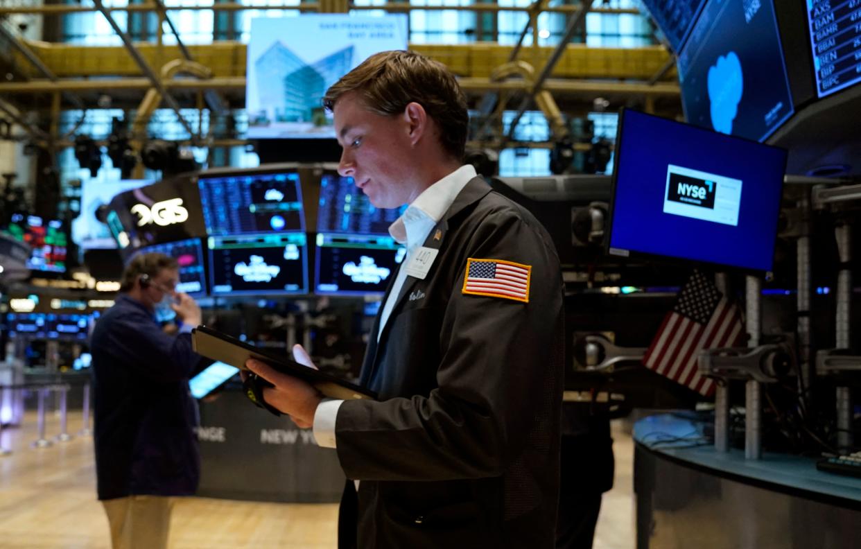 Traders work on the floor during the opening bell of the New York Stock Exchange in New York City on May 16, 2022. - US stocks were off to a downbeat start Monday following the rally in the prior session, as concerns about growth in the domestic and global economies continue. (Photo by TIMOTHY A. CLARY / AFP) (Photo by TIMOTHY A. CLARY/AFP via Getty Images)