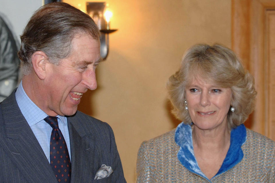 TETBURY, UNITED KINGDOM - DECEMBER 19:  (NO PUBLICATION IN UK MEDIA FOR 28 DAYS) Prince Charles, Prince of Wales and Camilla, Duchess of Cornwall meet staff, children and their parents from Ty Hafan Children's Hospice, Cardiff at Highgrove House on December 19, 2005 in Tetbury, Gloucestershire, United Kingdom. Ten excited youngsters were invited to the Prince's Highgrove estate in Gloucestershire to help the Royal couple decorate their Christmas tree. Charles and Camilla spent nearly an hour chatting and joking with the children, who were all being cared for at the Ty Hafan children's hospice in Barry, South Wales. (Photo by Pool-Anwar Hussein Collection/Getty Images)