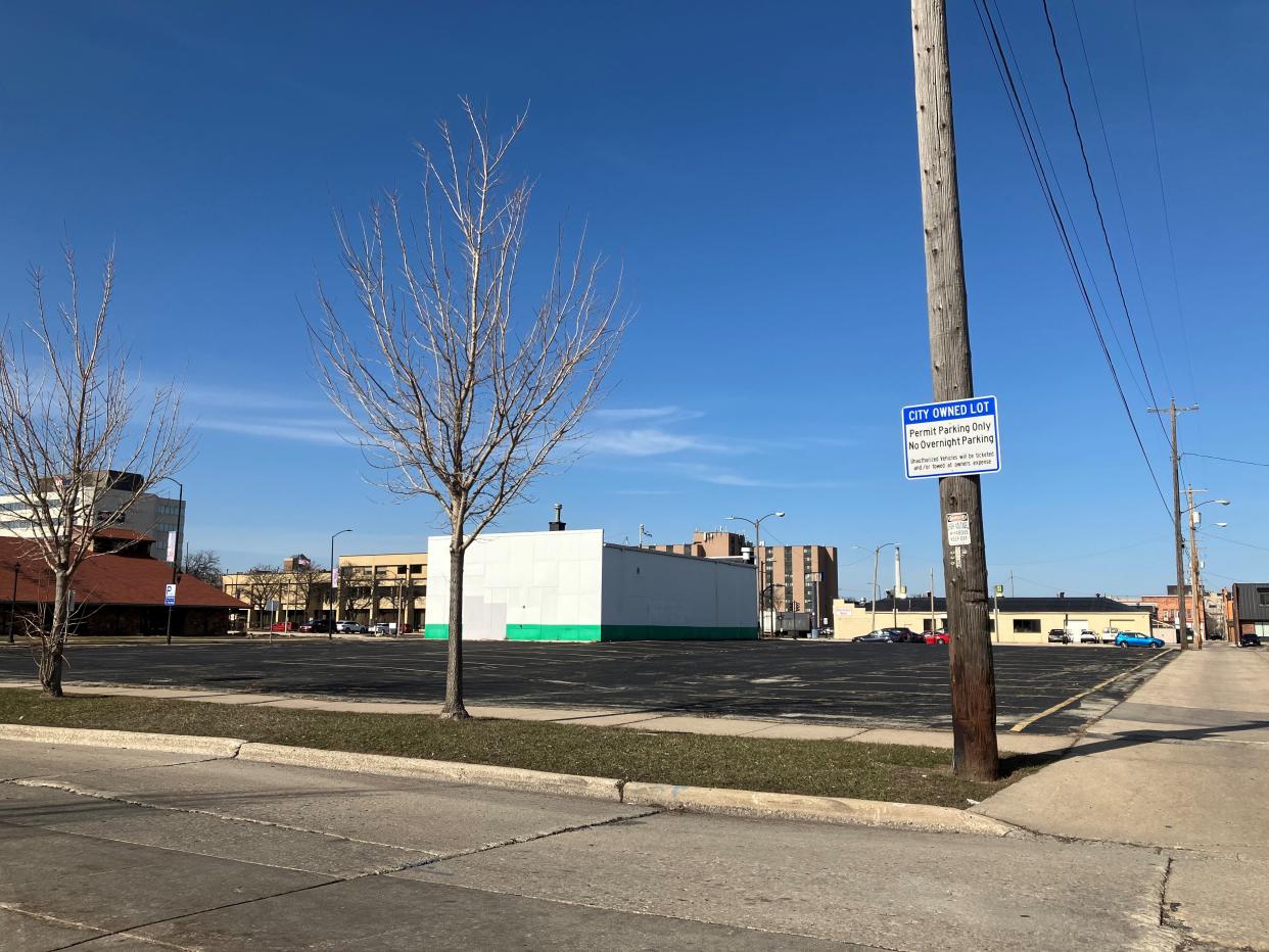 A Wisconsin-based developer plans to revise plans to redevelop a vacant parking lot in the 200 block of North Monroe Avenue for a third time in spring 2024.