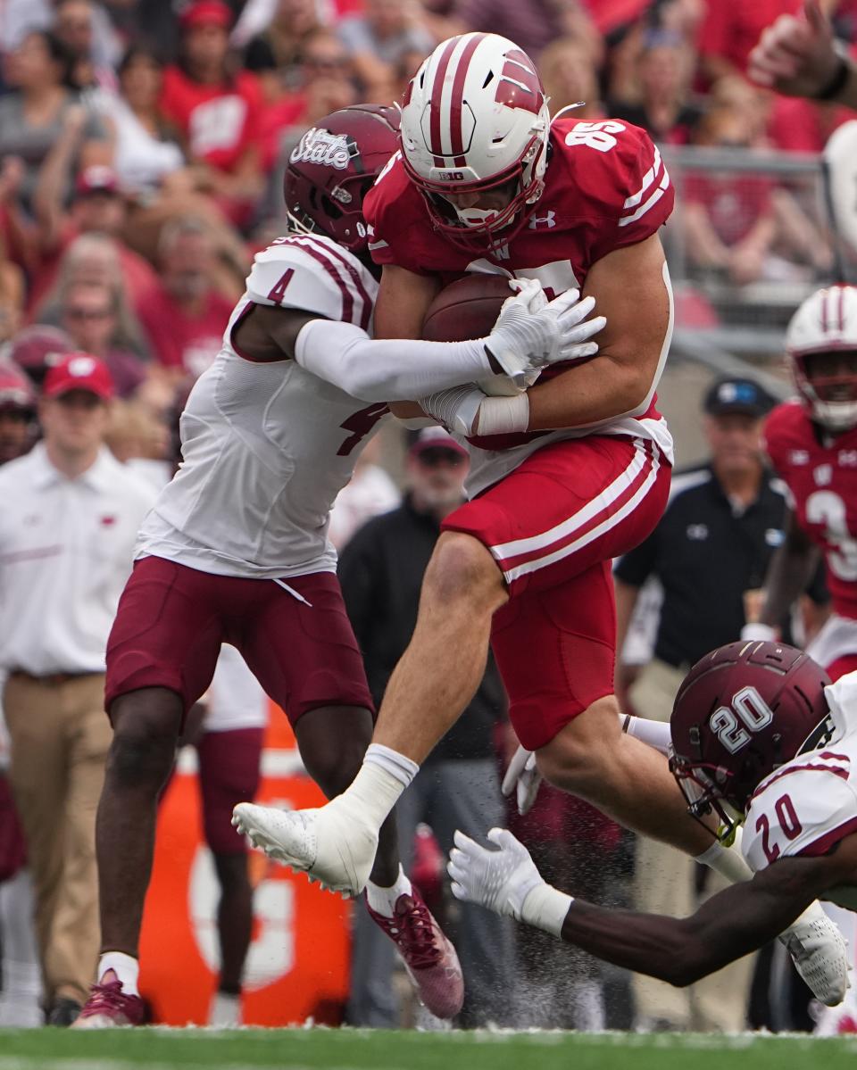 Wisconsin tight end Clay Cundiff (85) picks up 47 yards on a reception before being tackled by New Mexico State defensive back BJ Sculark (4)during the second quarter of their game Saturday, September 17, 2022 at Camp Randall Stadium in Madison.