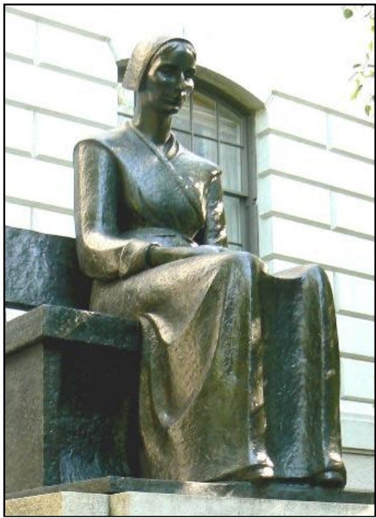 Religious martyr, Mary Dyer, sits at the Hooker Entrance of the State House, her image is part of the compilation of visual information: Women Subjects/Women Artists commemorates Women's History Month at the Massachusetts State House