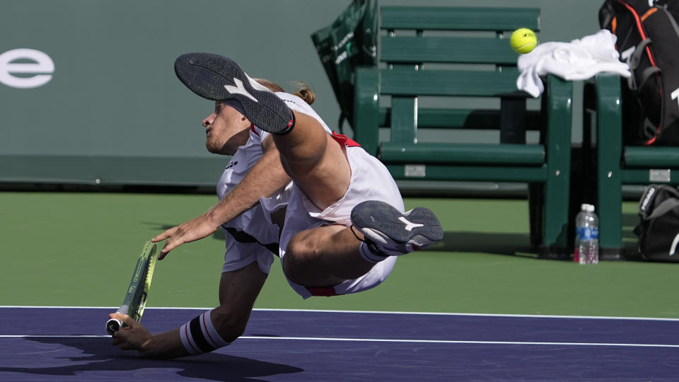 Alejandro Davidovich Fokina, of Spain, dives for the ball after missing a return to Daniil Medvedev, of Russia, at the BNP Paribas Open tennis tournament Wednesday, March 15, 2023, in Indian Wells, Calif. (AP Photo/Mark J. Terrill)