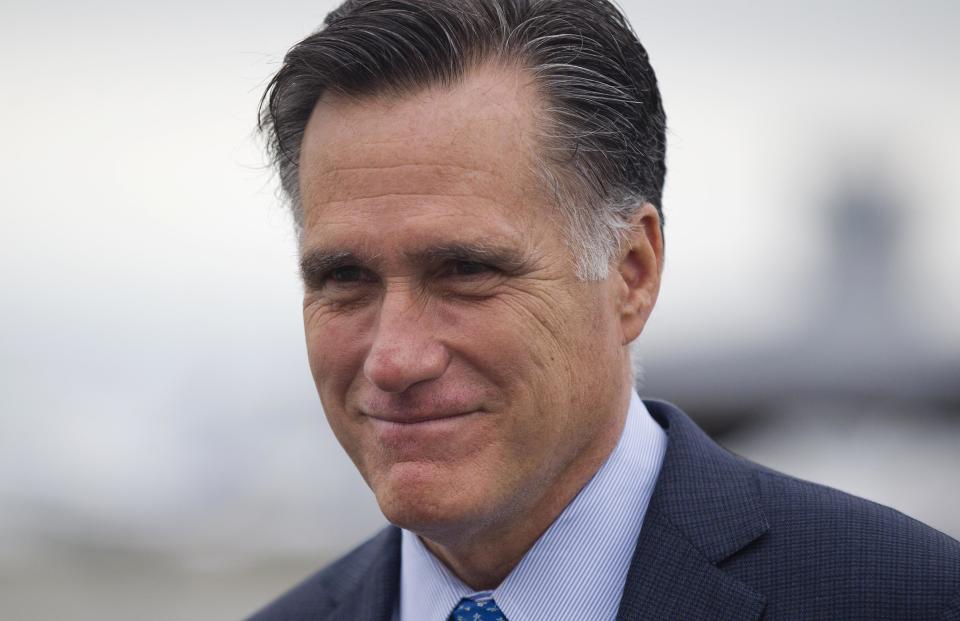 Republican presidential candidate, former Massachusetts Gov. Mitt Romney walks to his car to attend a fundraising event on Saturday, Aug. 18, 2012 in Nantucket, Mass. (AP Photo/Evan Vucci)