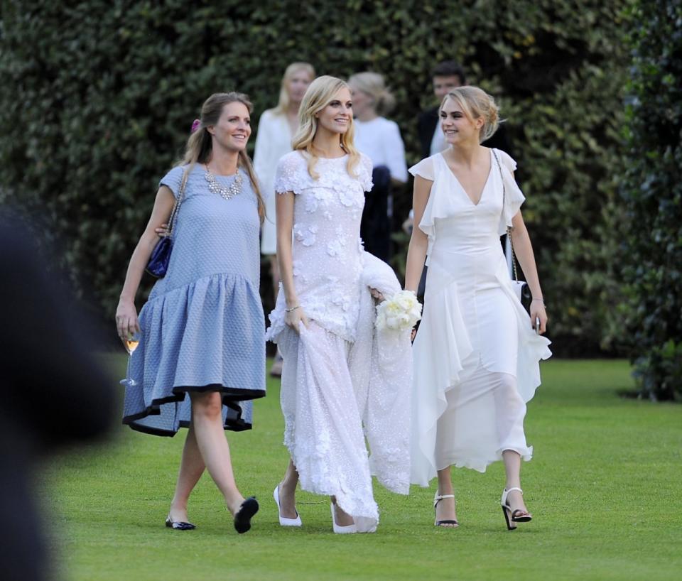 Chloe Delevingne, Poppy Delevingne and Cara Delevingne are seen at Poppy Delevingnes and James Cook's wedding reception held in Kensington Palace Gardens on May 16, 2014 in London, England. 