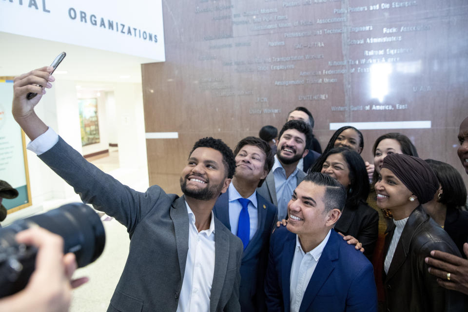 FILE - Members of the Congressional Progressive Caucus and other progressive candidates pose for a selfie taken by Rep.-elect Maxwell Frost, D-Fla., at AFL-CIO headquarters in Washington on Sunday, Nov. 13, 2022. For many progressives, the past decade has been littered with disappointments. But recent down-ballot victories are providing hope of reshaping the Democratic Party from the bottom up, rather than from Washington. (AP Photo/Amanda Andrade-Rhoades, File)