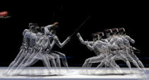 This multiple exposure photo shows Italy's Elisa Di Francisca, left, and Korea's Nam Hyun Hee competing during a semifinal fencing match at the 2012 Summer Olympics, Saturday, July 28, 2012, in London. (AP Photo/Andrew Medichini)