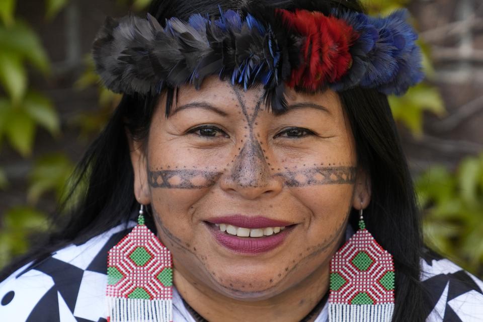 Munduruku leader Alessandra Korap poses at the Fairmont Hotel in San Francisco, Wednesday, April 19, 2023. Korap, from the Brazilian Amazon, has been awarded the prestigious Goldman Environmental Prize for her work fighting against illegal mining and large-scale projects aimed at facilitating soybean exports in the Tapajos River Basin. (AP Photo/Eric Risberg)