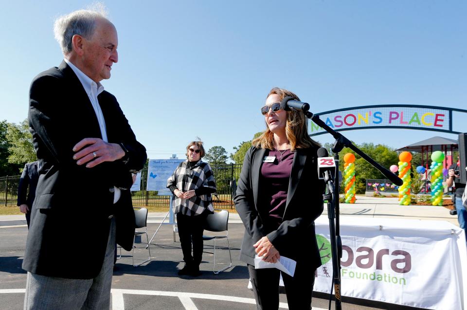 The All Inclusive Playground at Sokol Park opened and was christened Mason's Place Wednesday, April 21, 2021, in Tuscaloosa. Playground namesake Barry Mason speaks to Adrian Cleckler, the playground's project manager, in front of the playground that bears his name. [Staff Photo/Gary Cosby Jr.][Staff Photo/Gary Cosby Jr.]