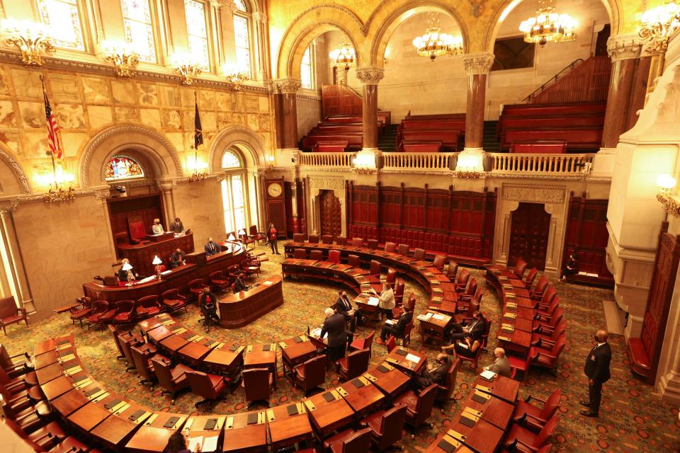 The New York State Senate Chamber sits mostly empty during a budget session in the New York State Capitol in Albany, New York, U.S., March 15, 2021. REUTERS/Angus Mordant