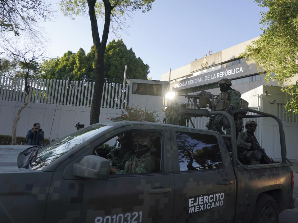 A heavily armed army convoy departs the prosecutor's building where Ovidio Guzmán, one of the sons of former Sinaloa cartel boss Joaquin "El Chapo" Guzmán, is in custody in Mexico City, Thursday, Jan. 5, 2023. The Mexican military has captured Ovidio Guzman during a operation outside Culiacan, a stronghold of the Sinaloa drug cartel in western Mexico. (AP Photo/Fernando Llano)