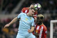 <p>Burnley’s Sam Vokes jumps for the ball during the English Premier League soccer match between Sunderland and Burnley </p>