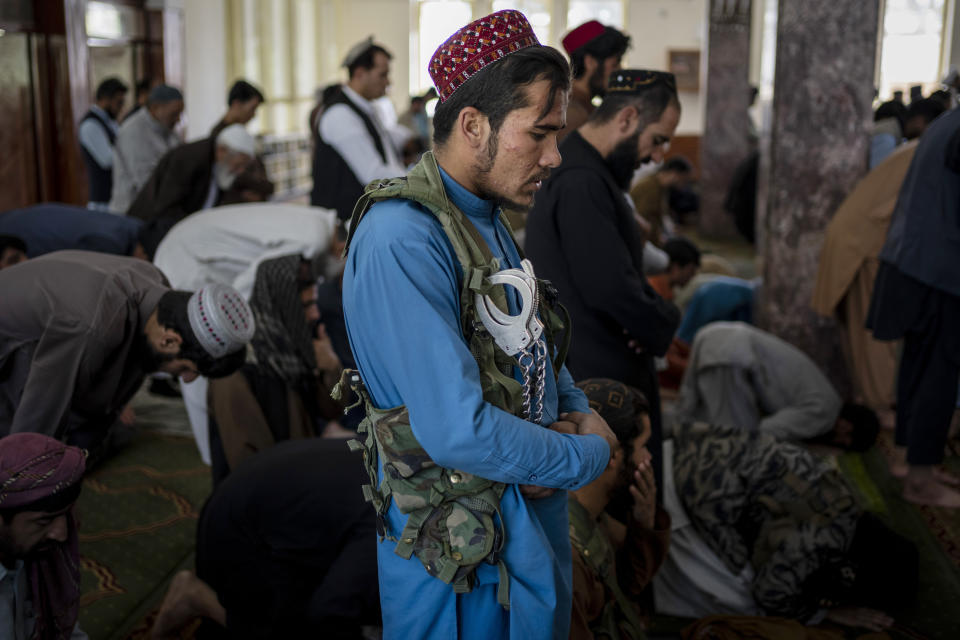A Taliban fighter prays inside a mosque during Friday prayers in Kabul, Afghanistan, Friday, Sept. 17, 2021. (AP Photo/Bernat Armangue)