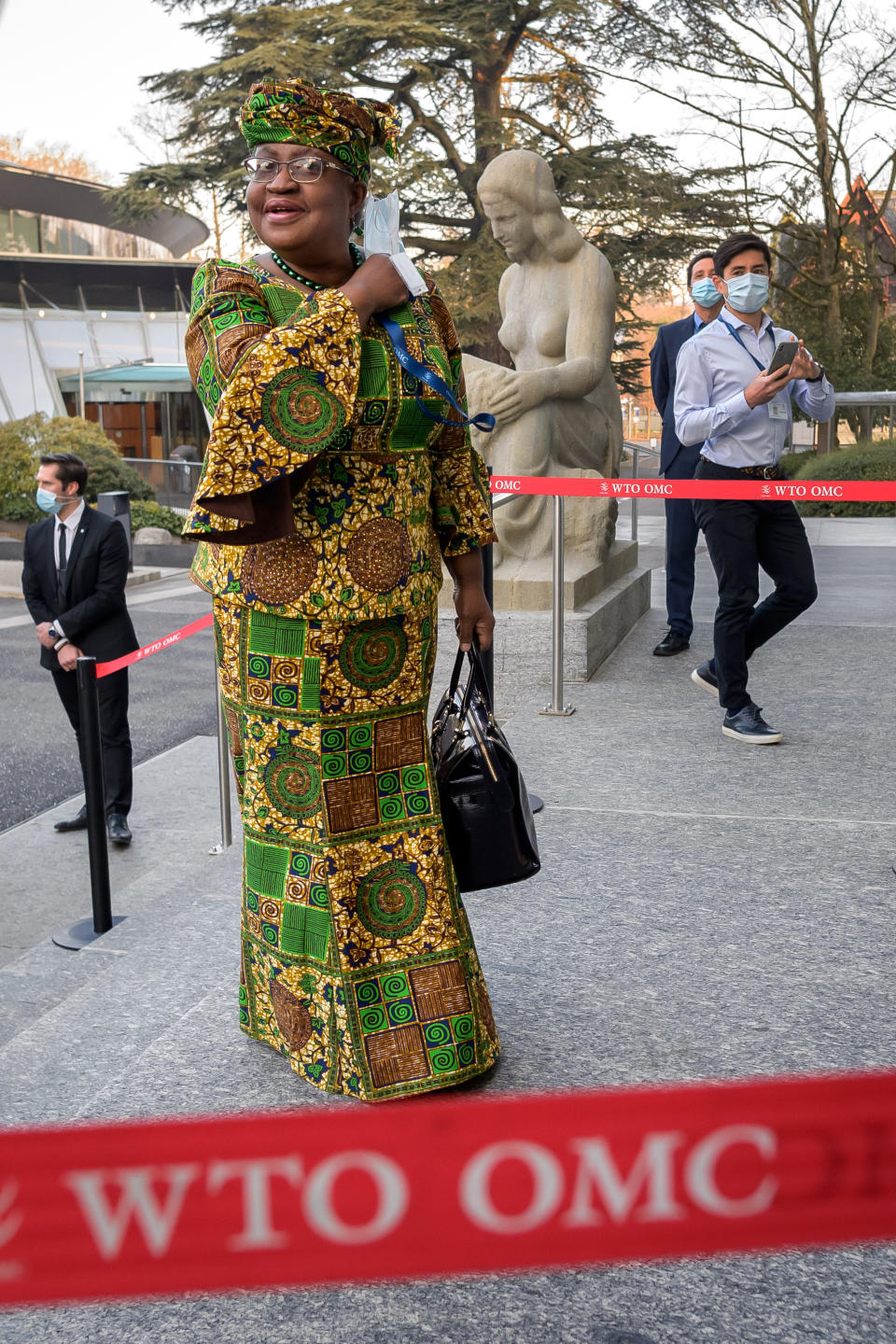 New Director-General of the World Trade Organisation (WTO) Ngozi Okonjo-Iweala arrives at the WTO headquarters to takes office in Geneva, Switzerland, Monday, March 1, 2021. Nigeria's Ngozi Okonjo-Iweala takes the reins of the WTO amid hope she will infuse the beleaguered body with fresh momentum to address towering challenges and a pandemic-fuelled global economic crisis. (Fabrice Coffrini/Pool/Keystone via AP)