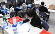Students take coronavirus disease (COVID-19) tests at Harris Academy Beckenham, ahead of full school reopening in England in Beckenham, south east London
