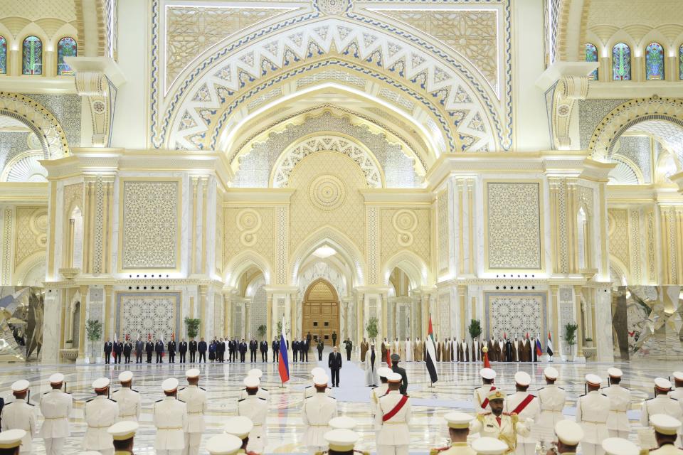 Emirati President Sheikh Mohammed bin Zayed Al Nahyan, center right, and Russian President Vladimir Putin, center left, attend an official welcome ceremony at Qasr Al Watan, Abu Dhabi, United Arab Emirates, Wednesday, Dec. 6, 2023. (Sergei Savostyanov, Sputnik, Kremlin Pool Photo via AP)