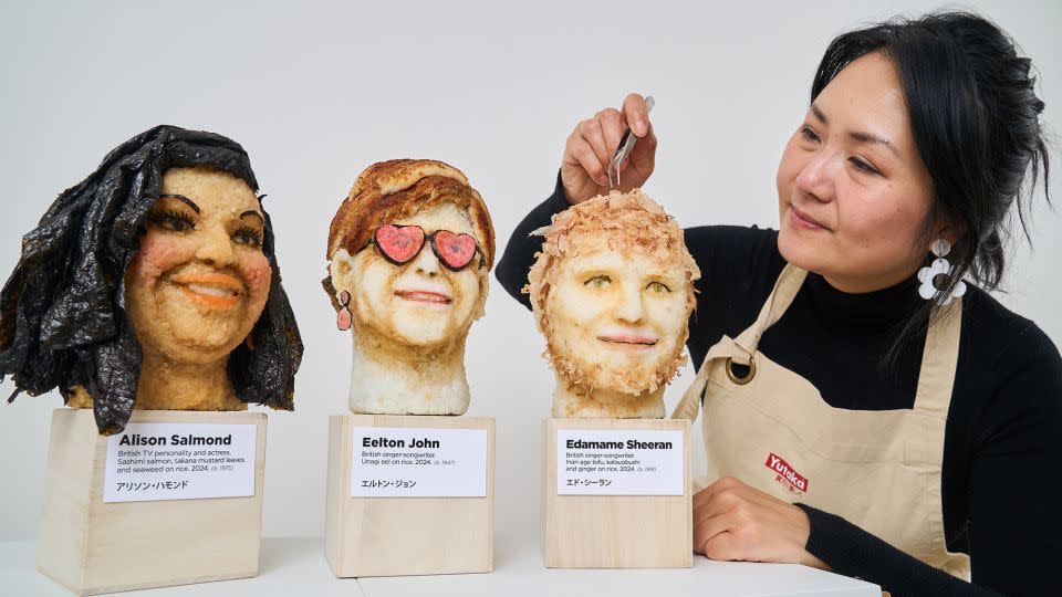 Wibowo puts the finishing touches to Sheeran, whose pun-y likeness is pictured alongside "Eelton" John and British TV host Alison "Salmond" Hammond. - Simon Jacobs/PinPep