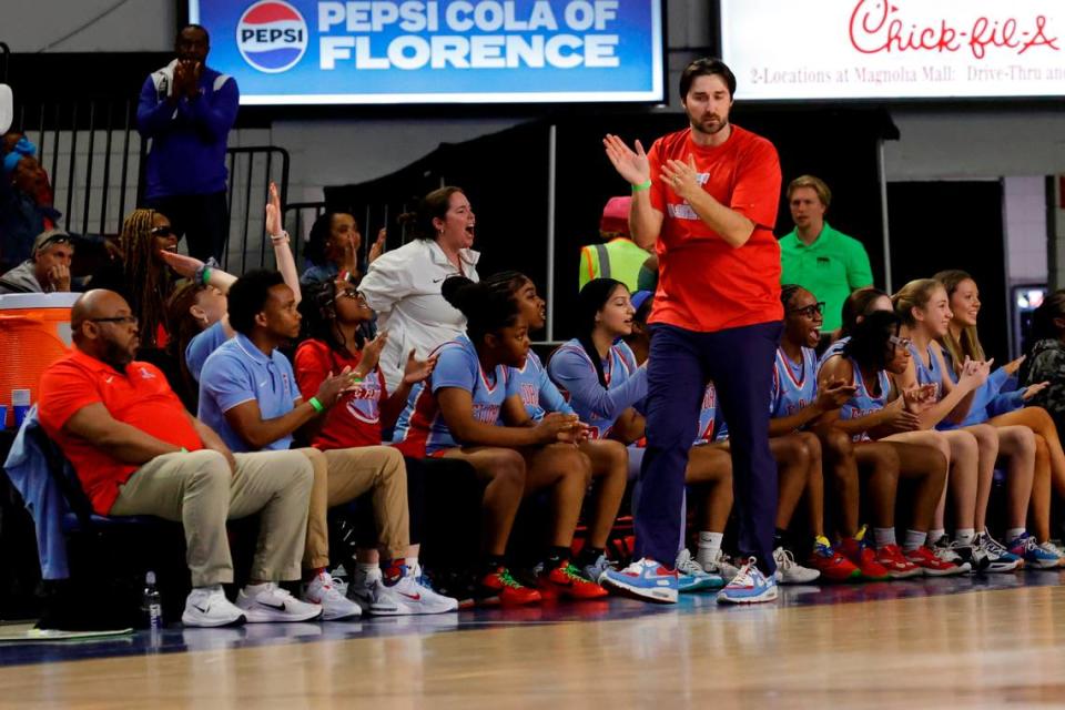 AC Flora’s head coach, Jacob Thompson, applauds a play during the first half of action against Riverside at the Florence Center in the Class 4A girls basketball championship game on Saturday, March. 2, 2024. Tracy Glantz/tglantz@thestate.com