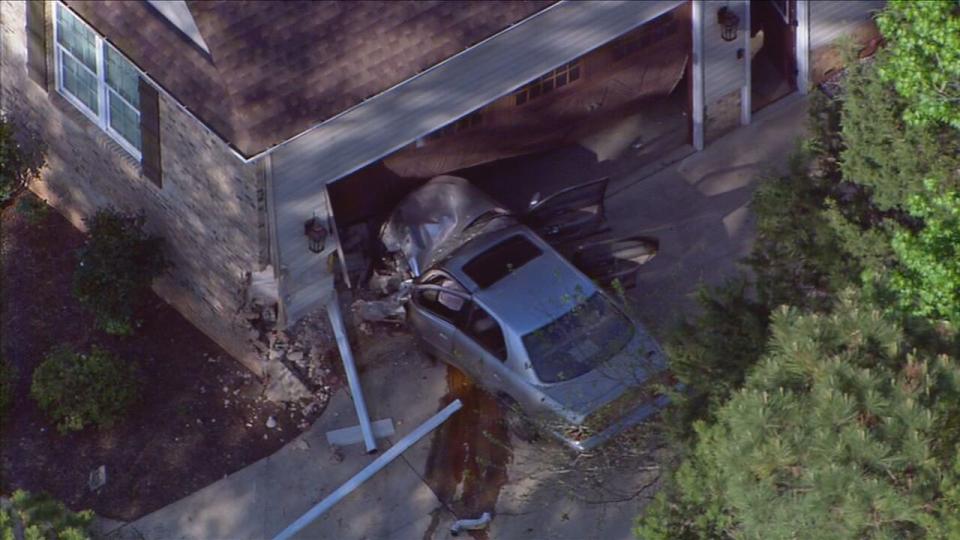 A car crashed into a home along Neely Store and Walker roads in Rock Hill after a chase was terminated, deputies said.