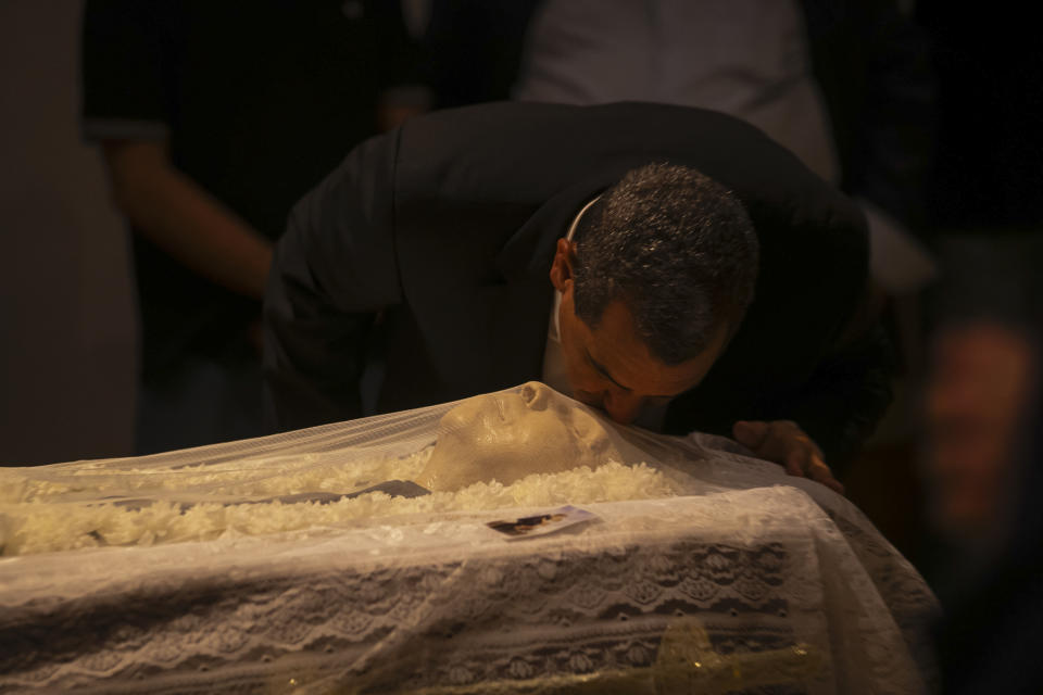 Brazil's former soccer player Zinho pays his final respects to former Brazilian soccer coach and player Mario Zagallo, during a funeral service at the Brazilian Football Confederation headquarters in Rio de Janeiro, Brazil, Sunday, Jan. 7, 2024. Zagallo, who reached the World Cup final a record five times, winning four, as a player and then a coach with Brazil, died at the age of 92. (AP Photo/Bruna Prado)