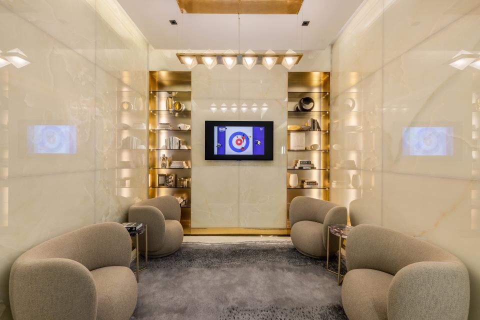 gray, rounded chairs in a lounge area on the 16th floor in luxury skyscraper Central Park Tower