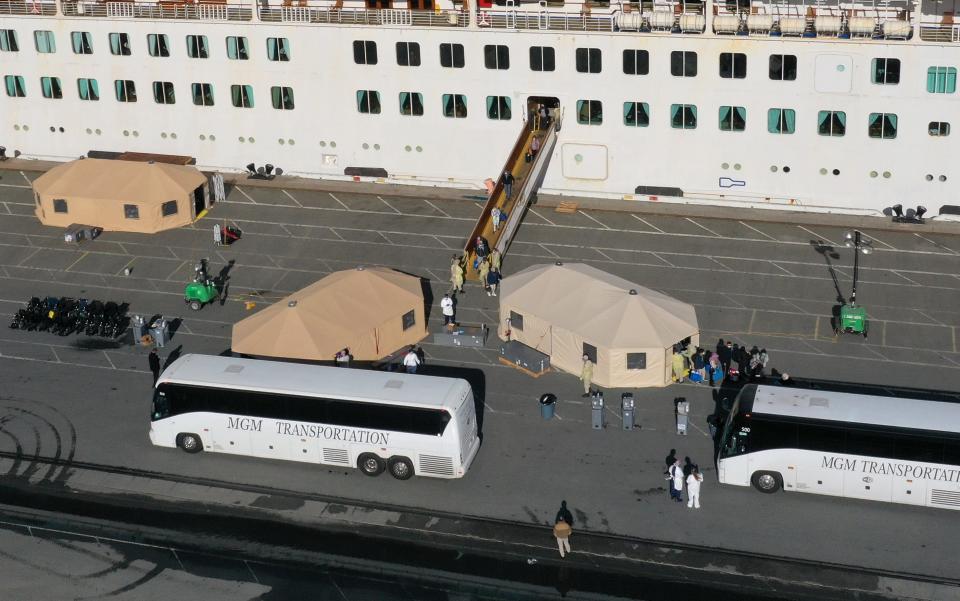 Passengers are evacuated from the Grand Princess cruise ship March 10 in Oakland, Calif.