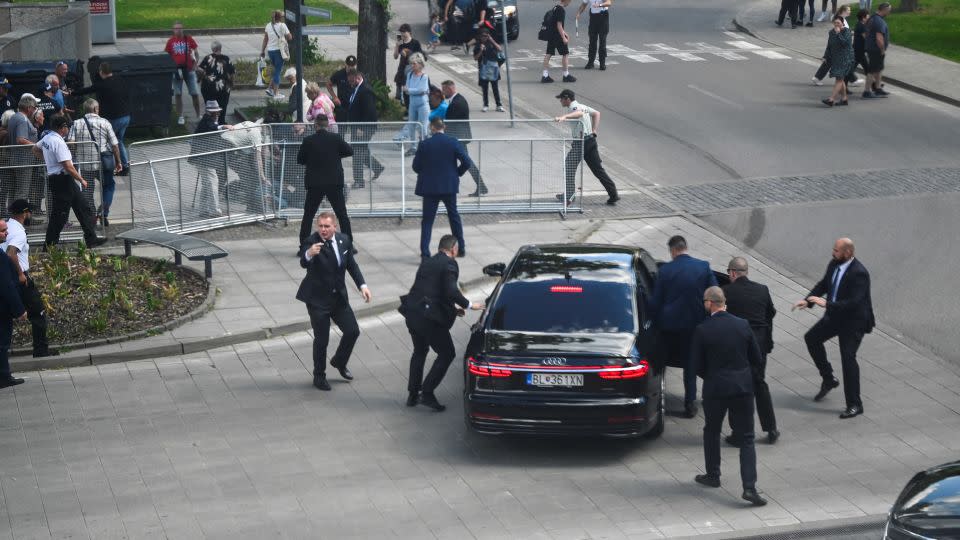 Security officers move Slovak PM Robert Fico in a car after a shooting incident, after a Slovak government meeting in Handlova, Slovakia, May 15, 2024. REUTERS/Radovan Stoklasa - Radovan Stoklasa/Reuters