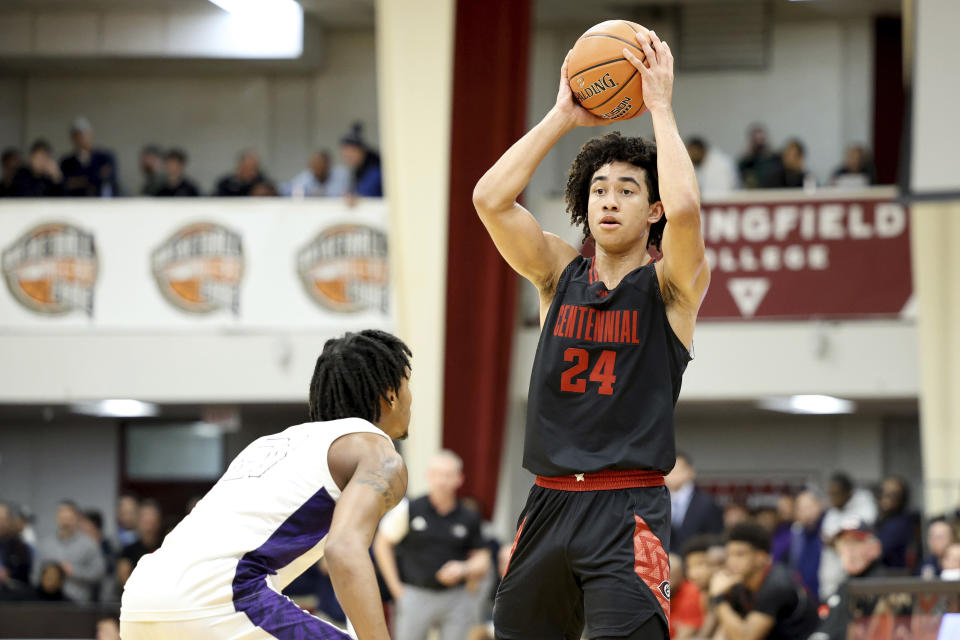 Centennial's Jared McCain, right, looks to pass against Camden during a high school basketball game at the Hoophall Classic, Saturday, Jan. 14, 2023, in Springfield, Mass. The 6-3 guard was rated 14th in the 247Sports Composite, making him the top prospect in a Duke class that ranked second nationally. (AP Photo/Gregory Payan, File)