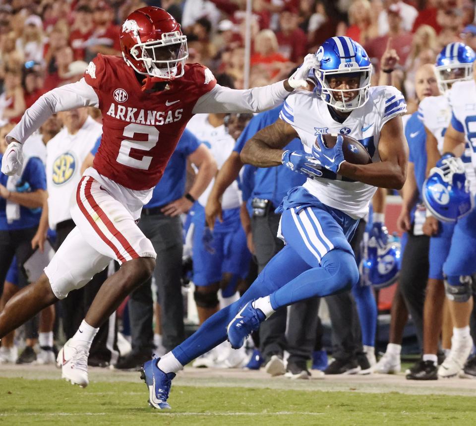 Brigham Young Cougars wide receiver Keelan Marion (17) runs for a touchdown against Arkansas Razorbacks defensive back Dwight McGlothern (2) at Razorback Stadium in Fayetteville on Saturday, Sept. 16, 2023. BYU won 38-31. | Jeffrey D. Allred, Deseret News