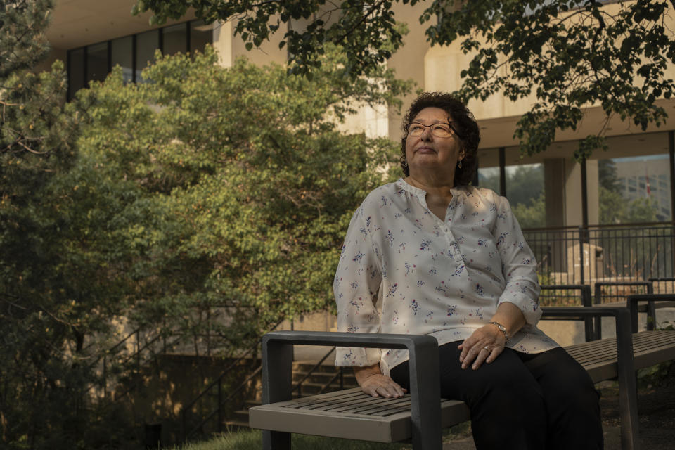 May Sarah Cardinal sits for a portrait outside the Law Courts building in Edmonton, Alberta, Canada on Thursday, May 25, 2023. Cardinal said she was pressured into having her tubes tied when she was 20, after having her second child in 1977, but the doctor never explained the procedure was irreversible. (AP Photo/Amber Bracken)