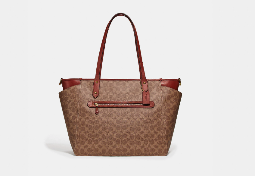 Baby Bag In Signature Canvas. Image via Coach.