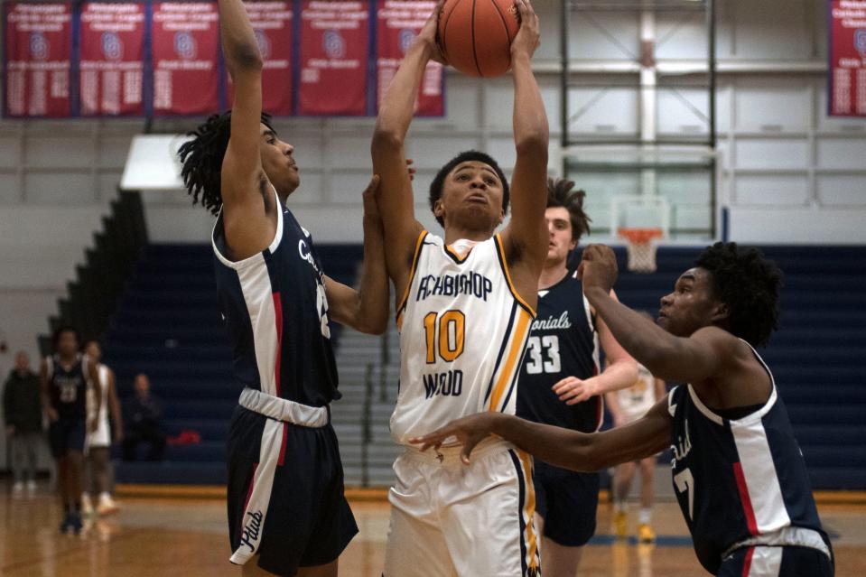 Archbishop Wood sophomore Jalil Bethea battles to get through Plymouth Whitemarsh defense at Cardinal O'Hara High School on Wednesday, March 9, 2022. Archbishop Wood defeated Plymouth Whitemarsh in the first round of PIAA boys basketball in class 6A, 77-50.