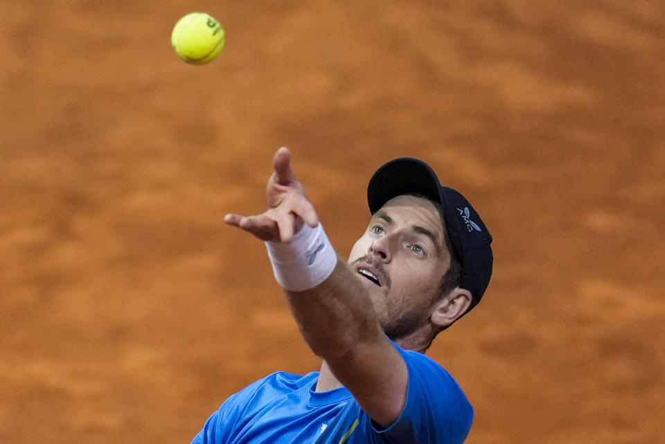 Andy Murray, of Britain, servers against Denis Shapovalov, of Canada, during their match at the Mutua Madrid Open tennis tournament in Madrid, Spain, Tuesday, May 3, 2022. (AP Photo/Manu Fernandez)