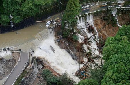 A collapsed road is seen following torrential rain caused by typhoon Lan in Kishiwada, Japan in this photo taken by Kyodo on October 23, 2017. Kyodo/via REUTERS