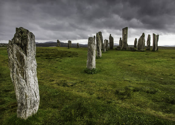 The Callanish Stones are located on the island of Lewis, part of the Hebrides archipelago sitting off the northwest coast of Scotland. The stones were likely built in the Neolithic period and used as an ancient calendar during the Bronze Age, s