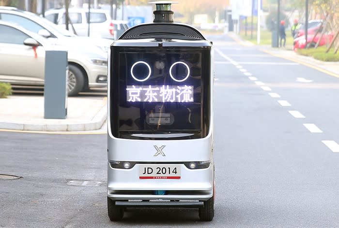 JD.com's autonomous delivery robot on a street.