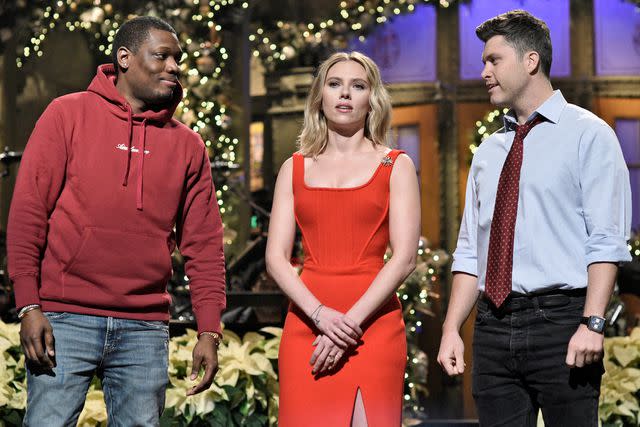 <p>Will Heath/NBC/NBCU Photo Bank via Getty</p> Michael Che, Scarlett Johansson, and Colin Jost on 'Saturday Night Live'