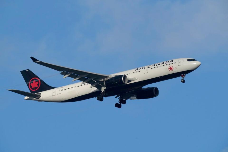 An Air Canada Airbus A330 approaches for landing in Lisbon on Saturday, September 2 (AP)