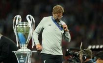 <p>Another one for the the collection: Jurgen Klopp picks up his runner-up medal</p>