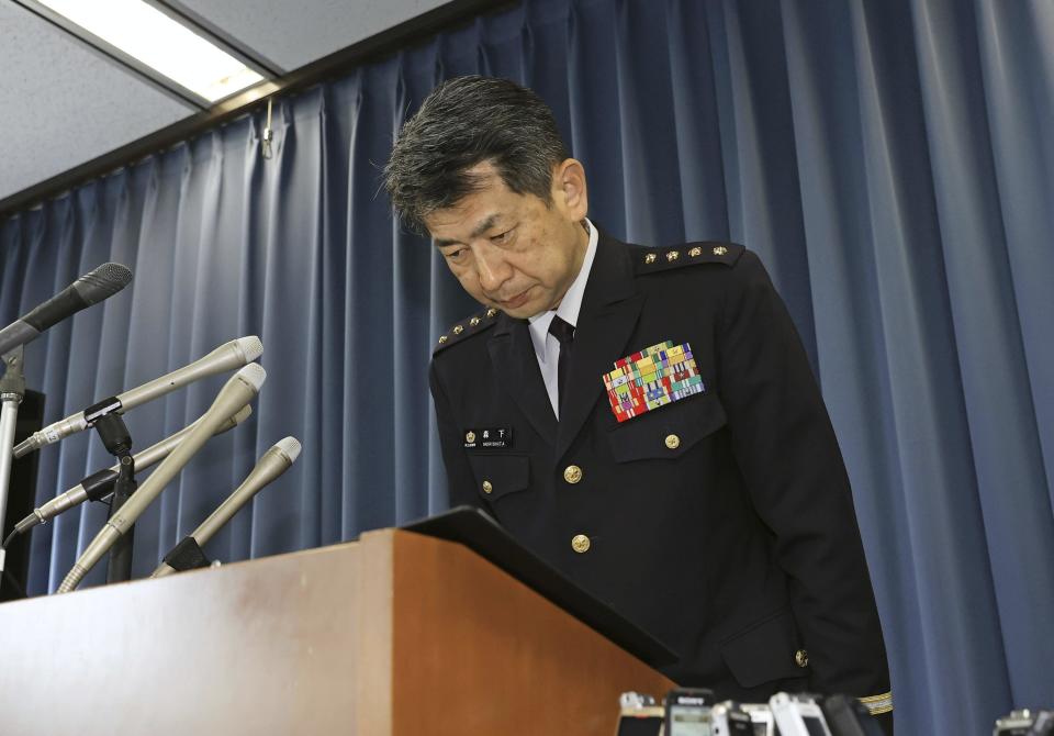 The Japan Ground Self-Defense Force's Chief of the Ground Staff Yasunori Morishita bows during a press conference at the Defence Ministry Wednesday, June 14, 2023 in Tokyo. A Japanese soldier was arrested Wednesday after allegedly shooting three colleagues at an army base in central Japan, officials said. (Kyodo News via AP)