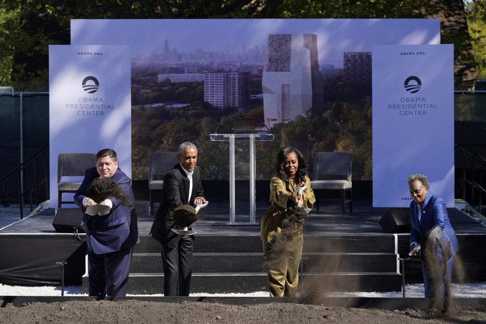 Former President Barack Obama, second from left, is joined by Illinois Gov. J.B. Pritzker, left, former first lady Michelle Obama, and Chicago Mayor Lori Lightfoot during a groundbreaking ceremony for the Obama Presidential Center Tuesday, Sept. 28, 2021, in Chicago. (AP Photo/Charles Rex Arbogast)