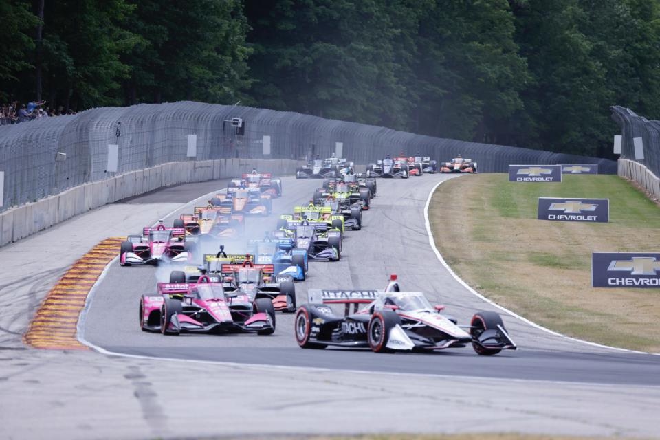 Pole-sitter Josef Newgarden leads the field through Turn 5 on the first lap of the 2021 NTT IndyCar Series REV Group Grand Prix at Road America.