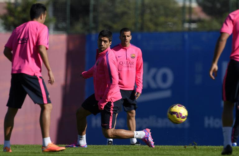 Luis Suarez (centre) takes part in a training session at the Sports Center FC Barcelona Joan Gamper in Sant Joan Despi, near Barcelona on October 24, 2014