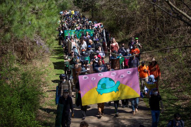 Protesters hold a sign of a turtle on March 4 in Atlanta to honor Manuel 