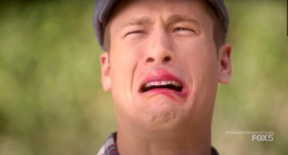 Chad Radwell (Glen Powell) cries with a lipstick stain on his mouth in "Scream Queens."